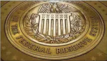  ?? ANDREW HARNIK / AP FILE ?? In this 2018, file photo, the seal of the Board of Governors of the United States Federal Reserve System is displayed in the ground at the Marriner S. Eccles Federal Reserve Board Building in Washington.