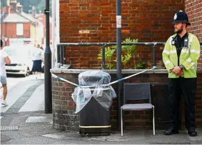  ?? — Reuters ?? High alert: A police officer guarding a cordoned off rubbish bin on Rolleston Street, after it was confirmed that two people had been poisoned with the nerve-agent Novichok in Salisbury, Britain.