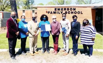  ??  ?? Mayor Lynn Spruill, Superinten­dent Dr. Eddie Peasant, and Fire Chief Charles Yarborough stand with Emerson Family Center staff and members of the community to proclaim April as Child Abuse Prevention and Awareness Month in Starkville. (Photo by Jessica Lindsey, SDN)