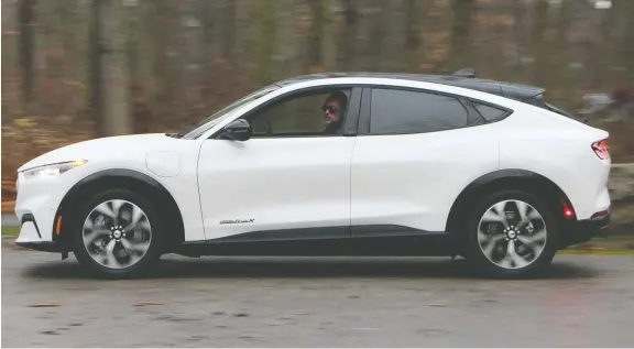  ?? PHOTOS: DAVID BOOTH/ DRIVING ?? The all new Mustang Mach-e scores impressive marks for its range and interior quality, but does come up a bit short in recharging speed.