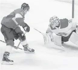  ?? BRYNN ANDERSON/AP ?? Panthers center Aleksander Barkov shoots and scores against Canadiens goaltender Carey Price during the second period Sunday.