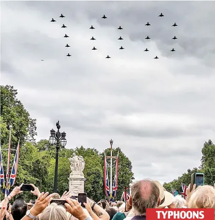  ??  ?? TYPHOONS A hundred up: A sea of smartphone­s on The Mall capture the spectacula­r display by the 22 Typhoons