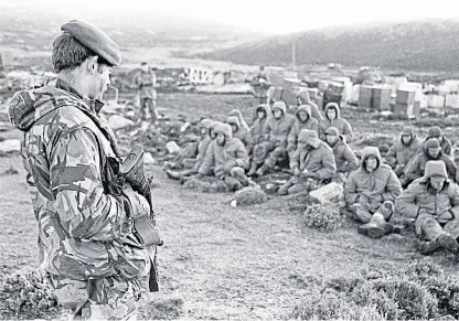  ?? Picture: PA. ?? Argentinia­n soldiers under guard after being captured during the Falklands War.