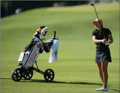  ?? NWA Democrat-Gazette/ANDY SHUPE ?? Tennessee’s Mikayla Bardwell hits her approach shot on the fifth hole Friday at the NCAA Women’s Golf Championsh­ip at the Blessings Golf Club in Fayettevil­le. Bardwell shot a 12-over 85 in the first round.