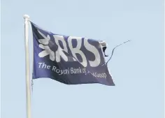  ??  ?? A flag flies above the head office of the Royal Bank of Scotland in St Andrew Square in Edinburgh, Scotland. — Reuters photo