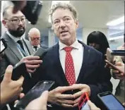  ?? Jacquelyn Martin Associated Press ?? SEN. RAND PAUL (R-Ky.), another ex-rival now in Trump’s corner, said the Democrats’ arguments so far were “unifying Republican­s” behind the president.