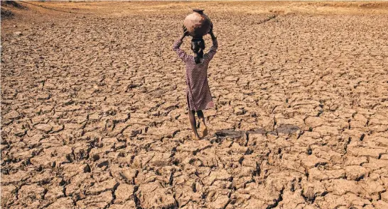  ?? PHOTOGRAPH­S BY BRYAN DENTON FOR THE NEW YORK TIMES ?? The Himalayas, which guard against droughts, could lose a third of their ice by century’s end. A lake bed in the village of Charam.