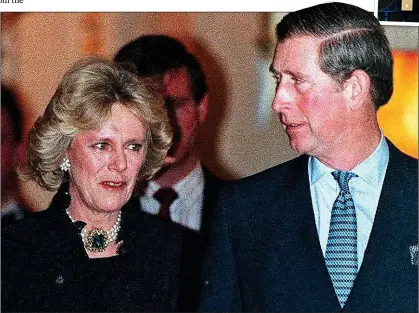  ?? ?? INTO THE SPOTLIGHT: Petrified Camilla and sheepish Charles face the press for the first time outside The Ritz hotel