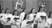  ?? Associated Press photo ?? In this Nov. 14 photo, sisters sing at the Dominican Sisters of Mary, Mother of the Eucharist chapel in Ann Arbor, Mich.