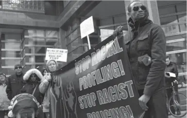  ?? RENÉ JOHNSTON/TORONTO STAR ?? Members of the Justice is Not Colour Blind Campaign demonstrat­e against racial profiling before Toronto police board meeting.