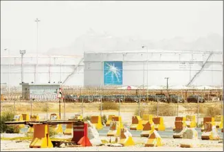  ?? ?? Storage tanks are seen at the North Jiddah bulk plant, an Aramco oil facility, in Jiddah, Saudi Arabia, on March 21, 2021. Oil giant Saudi Aramco said Sunday, March 12, 2023, it earned a $161 billion profit last year, attributin­g its earnings to higher crude oil prices. (AP)