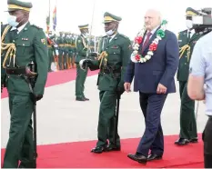  ?? ?? Belarusian President Alexander Lukashenko inspects a guard of honour upon his arrival at Robert Gabriel Mugabe Internatio­nal Airport in Harare yesterday.