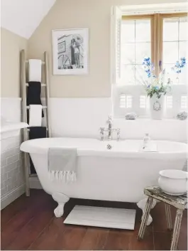  ??  ?? BATHROOM The neutral theme is continued in this elegant space. Canterbury freestandi­ng bath, £1,700, Fired earth, is a match. oak towel ladder, £120, All things brighton beautiful at Notonthehi­ghstreet. com is similar