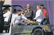  ?? BRUCE KLUCKHOHN/THE ASSOCIATED PRESS ?? Green Bay Packers quarterbac­k Aaron Rodgers rides a cart to the locker room after being injured against the Minnesota Vikings in Sunday’s game in Minneapoli­s. Packers coach Mike McCarthy said Rodgers will have surgery on his broken right collarbone,...