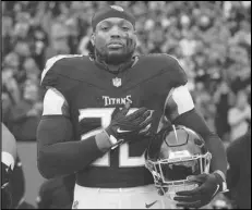  ?? Associated Press ?? Tennessee Titans running back Derrick Henry stands for the national anthem before a game against the Jacksonvil­le Jaguars, Jan. 7, in Nashville, Tenn. Henry was signed by the Ravens on Tuesday.