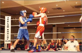  ??  ?? Ross Farrell (red trunks) boxing for Arklow against Tadgh O’Donnell of Four Kings Boxing Club.