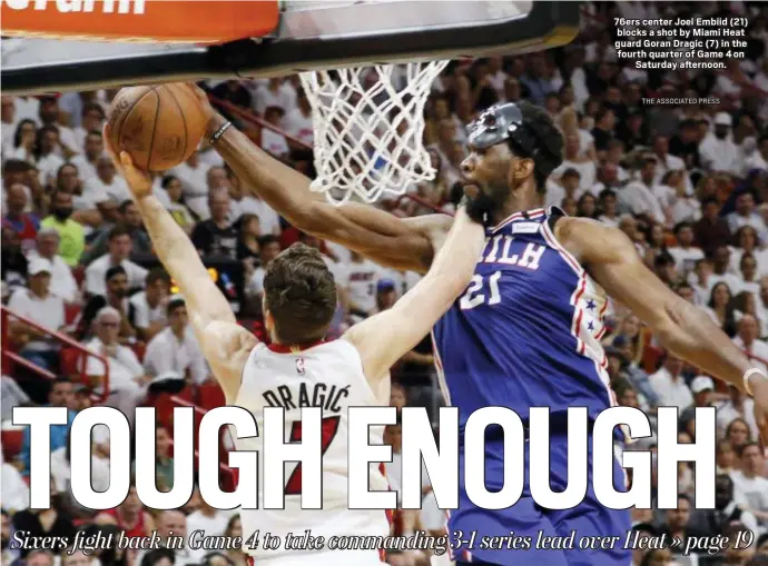  ?? THE ASSOCIATED PRESS ?? 76ers center Joel Embiid (21) blocks a shot by Miami Heat guard Goran Dragic (7) in the fourth quarter of Game 4 on Saturday afternoon.