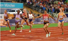  ?? Photograph: Kai Pfaffenbac­h/Reuters ?? Switzerlan­d's Mujinga Kambundji crosses the line ahead of Britain’s Dina Asher-Smith to win gold in the 200m.