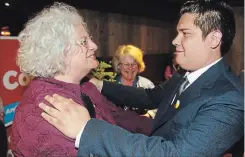  ?? CLIFFORD SKARSTEDT/EXAMINER ?? Peterborou­ghKawartha riding PC MPP-elect Dave Smith kisses his wife Lorien at the Holiday Inn on George St. after winning the riding. Peterborou­gh-Kawartha riding NDP candidate Sean Conway hugs Green Party candidate Gianne Broughton at The Social on...