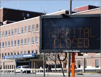  ?? PAUL CONNORS — BOSTON HERALD ?? Drivers will get used to seeing this sign as they drive past Brockton Hospital over the next few months. A 10-alarm fire has closed the hospital until at least May.