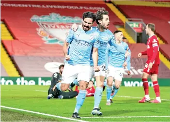  ??  ?? Gundogan (left) celebrates with Manchester City’s Portuguese midfielder Bernardo Silva after scoring the opening goal.