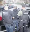  ?? — Reuters ?? US Immigratio­n and Customs Enforcemen­t officers detain a suspect as they conduct a targeted enforcemen­t operation in Los Angeles.