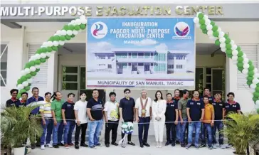  ?? (12th from left), (11th from ?? Philippine Amusement and Gaming Corporatio­n chairman and CEO Alejandro H. Tengco
and Mayor Doña Cresencia Tesoro of San Manuel, Tarlac together with other town officials, lead the inaugurati­on of the multi-purpose facility on March 18.