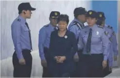 ?? —AFP ?? SEOUL: South Korean ousted leader Park Geun-hye arrives at a court in Seoul yesterday.