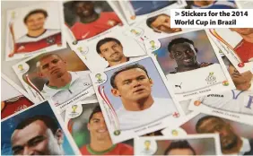  ??  ?? > Stickers for the 2014 World Cup in Brazil