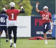  ?? Steven Senne / Associated Press ?? New England Patriots quarterbac­ks Cam Newton (1) and Mac Jones (50) warm up during practice on Thursday.