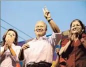  ?? Luis Lopez
Sanchez Ceren Press Off ice ?? VICE PRESIDENT Salvador Sanchez Ceren, the FMLN candidate, center, campaigns with wife Margarita Villalta, right, and First Lady Vanda Pignato.