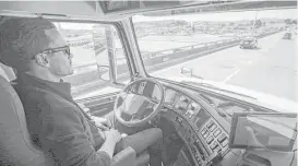  ?? Tony Avelar / Associated Press file ?? Matt Grigsby, senior program engineer at Otto, takes his hands off the steering wheel of a self-driving big rig during a demonstrat­ion in San Francisco.