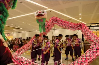  ?? ?? Festive dragon dance at Watsons Lunar New Year event