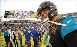  ?? MIKE EHRMANN / GETTY IMAGES ?? Blake Bortles of the Jacksonvil­le Jaguars walks off EverBank Field after winning the AFC wild card playoff game against Buffalo on Jan. 7 in Jacksonvil­le, Florida. His entire football career has played out within a 130-mile radius.