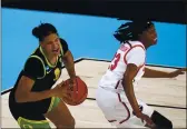  ?? ERIC GAY — THE ASSOCIATED PRESS ?? Oregon forward Nyara Sabally, left, drives arounds Georgia guard Que Morrison (23) during the first half in the second round of the women’s NCAA Tournament at the Alamodome in San Antonio on Wednesday.