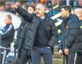  ??  ?? Manager Ray McKinnon shouts instructio­ns from the bench.