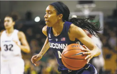  ?? Reinhold Matay / Associated Press ?? UConn guard Mikayla Coombs looks for room against Central Florida on Feb. 17 in Orlando, Fla.