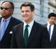  ?? PHOTOS BY CHRIS PEDOTA OF THE RECORD — NORTHJERSE­Y.COM VIA AP ?? Bill Baroni, center, walks away from the Federal Courthouse. Former aide Bridget Kelly and former bridge authority official Baroni are charged with closing bridge access lanes and causing gridlock to punish a Democratic mayor who didn’t endorse...