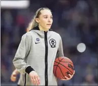  ?? Elsa / Getty Images ?? UConn freshman Paige Bueckers won the John R. Wooden Award on Monday, her fourth national player of the year award this season.