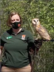  ??  ?? Mary Ewers Joyner, avian program coordinato­r for the Lorain County Metro Parks introduces “Luna,” a barn owl part of the Raptor Center and a wildlife ambassador.