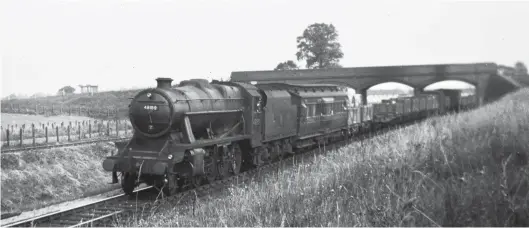  ?? R J Leonard/Kiddermins­ter Railway Museum ?? Having just passed through Patchway station, Stanier ‘8F’ class 2-8-0 No 48189 works an Acton yard to Severn Tunnel Junction goods train during its week of Western Region tests, the view dating from either Tuesday, 27 July 1948 or two days later. It is interestin­g to note that only the Stanier ‘8F’ and Thompson ‘O1’ types were scheduled for Western Region preliminar­y runs, such things generally only being for types where there was no local knowledge, all other runs being with a dynamomete­r car, the ex-North Eastern clerestory roof vehicle in this case. The train is descending at 1 in 80 at this point, the distant siding to the left being level, while unseen in cutting between this and the ‘8F’ is the up line, which is graded at 1 in 100. The pictured ‘8F’ was one of the 50 NBL-built examples for the LMS in 1942, with No 48189 serving until week ending 24 July 1965, its final shed being Speke Junction.