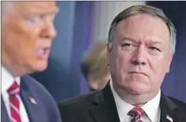  ?? Evan Vucci Associated Press ?? PRESIDENT TRUMP with Secretary of State Michael R. Pompeo. Designatin­g the Russian Imperial Movement as terrorists allows the U.S. to seize its assets.