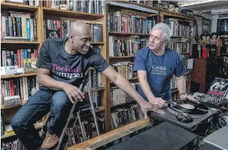  ?? ANDREW TESTA/THE NEW YORK TIMES ?? “If you wanted to be taken seriously, you saved up and you bought a pair,” DJ Barrington Oakley, left, said of the SL-1200s. Oakley is shown with DJ competitio­n organizer Tony Prince.