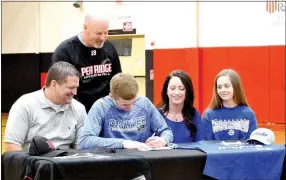  ??  ?? Blackhawk senior Cole Wright signs a letter to play baseball at Crowder College as his coach, John E. King, and family Brian Wright, father; Katie Wright, mother;and Lauren Wright, sister, look on.