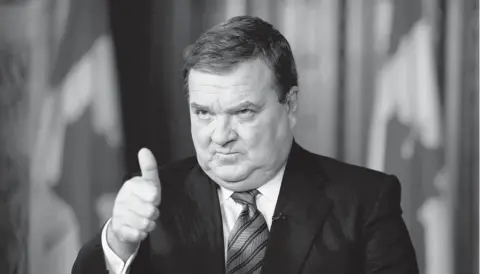  ?? ADRIAN WYLD / THE CANADIAN PRESS ?? Jim Flaherty’s new budget has met with approval as Canada is the only G7 nation with a AAA rating from Moody’s, Standard & Poor’s, and Fitch.