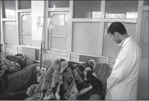  ?? AP ?? Afghans are treated at a hospital in the Khogeyani district of Nangarhar province after a bombing Friday, one of several Taliban attacks in the country.