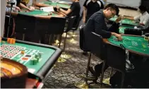  ??  ?? THIS picture taken on June 6 shows students practicing at the Japan Casino School in Tokyo. Japan has long been viewed as the Holy Grail of gaming in Asia due to a wealthy population, proximity to China and appetite for other forms of legal gambling,...