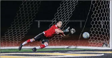  ?? PHOTOS BY KEITH THARP ?? Branham High School goalkeeper Chris Sagahon makes a diving save to end the game in the penalty-kick shootout against Mt. Pleasant in the CIF Central Coast Section Division II boys soccer championsh­ip game at Del Mar on Saturday. The teams played to a scoreless tie in regulation and overtime.