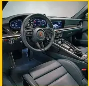  ??  ?? Interior is inspired by 911s of the 1970s – digital displays aside