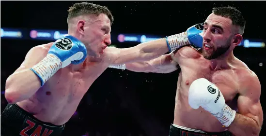  ?? ?? Nathaniel Collins ( right) in action against Zak Miller in Manchester last year. The Scot won the bout by judges’ decision after 12 rounds